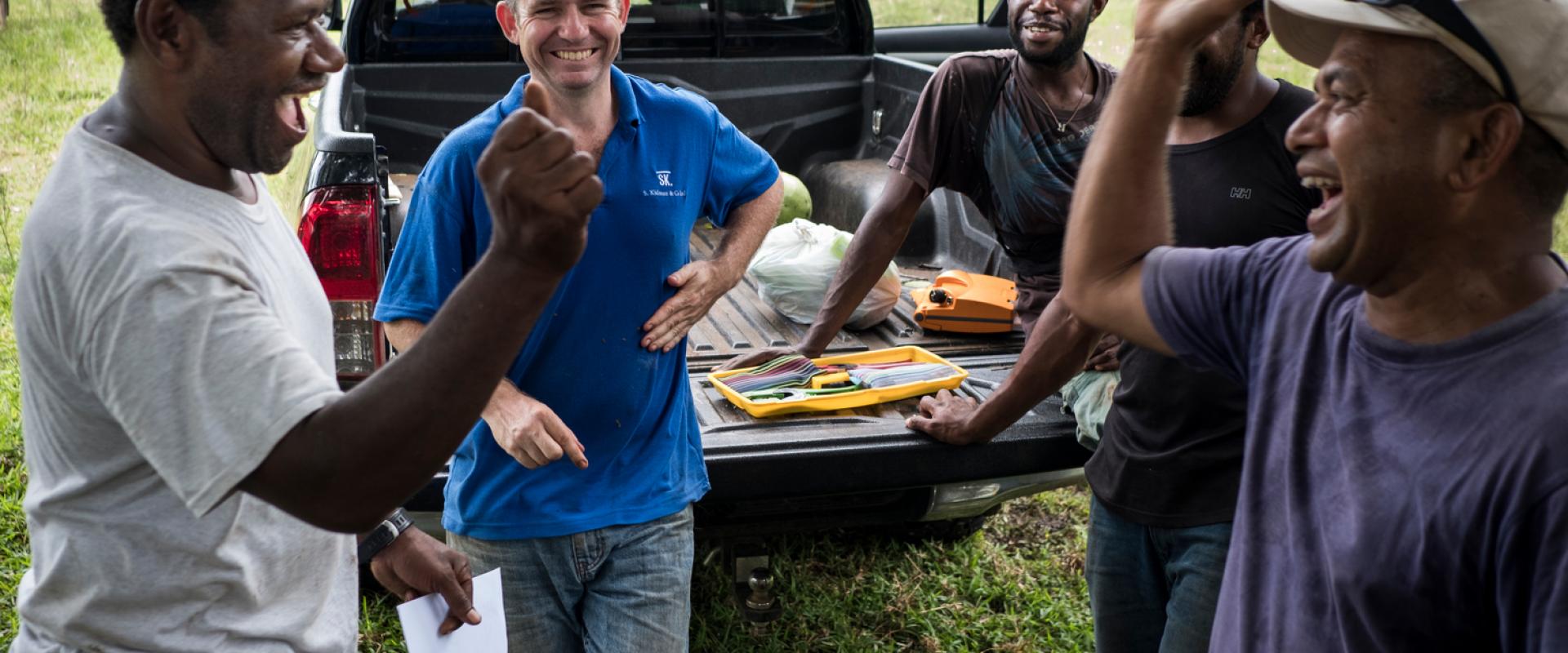 group of men high five each other 